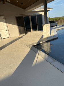 Outdoor patio with pool and modern design features.