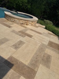 Patio and pool with stone tiles