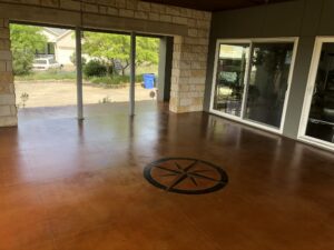 Covered patio with compass design on floor.