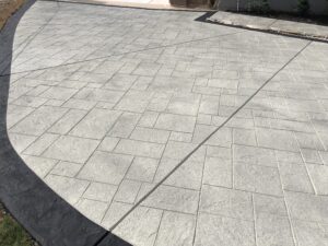 Stamped concrete driveway with decorative border