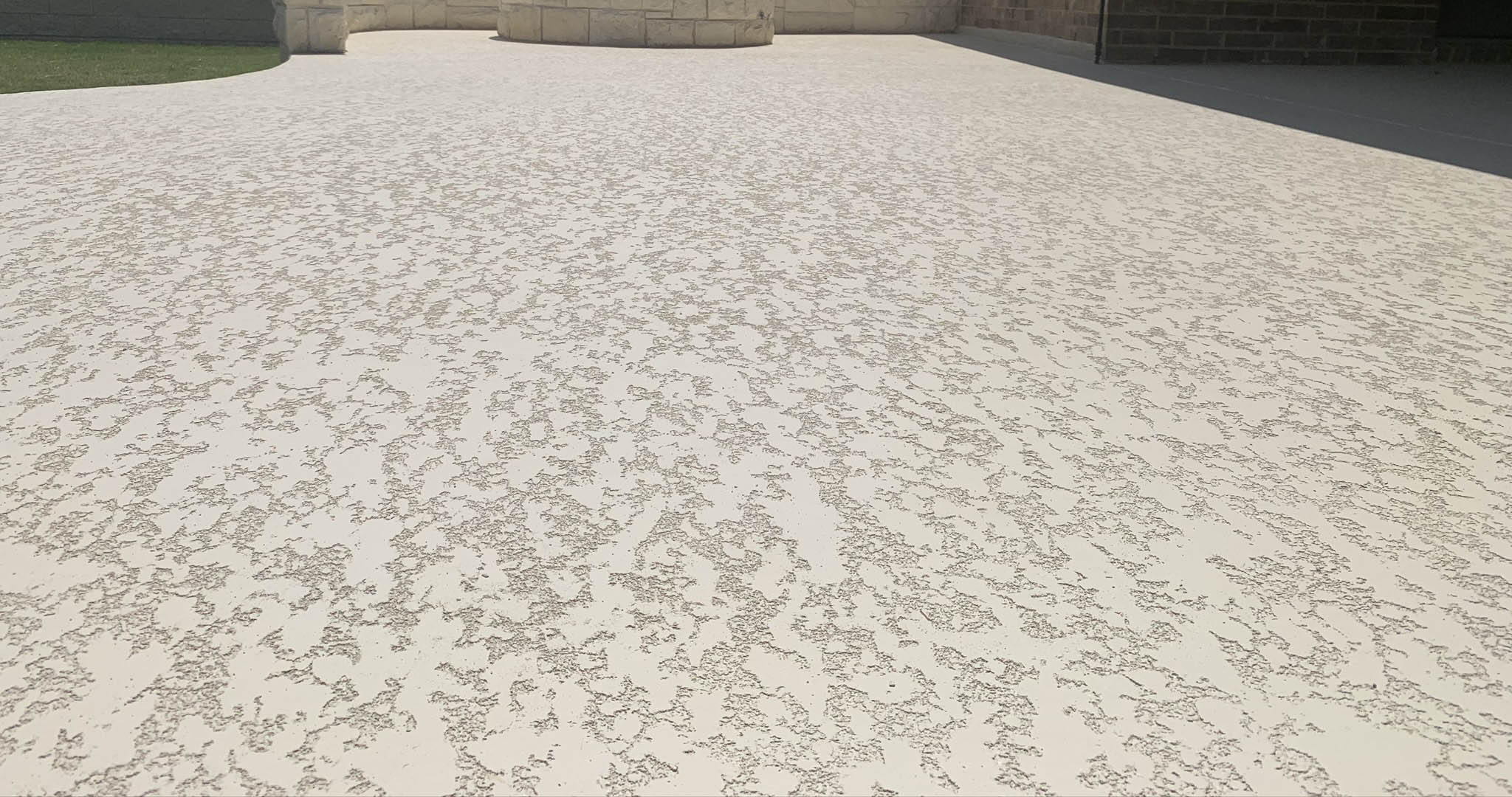 Photo-Jun-05-12-50-47-PM Textured concrete walkway with decorative pattern