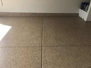 Polished tan garage floor with clean finish.