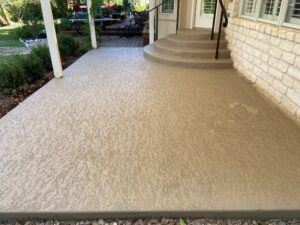 Textured patio with steps and outdoor seating