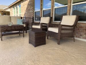 Cozy patio with wicker furniture and cushions