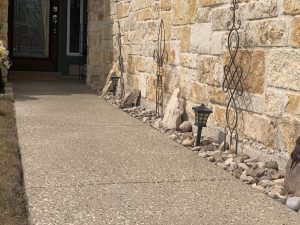 Stone walkway leading to brick house entrance