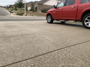 Red truck parked on suburban street