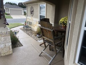 Front porch with chairs and flowers