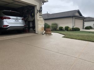 Car parked in a tidy suburban garage.